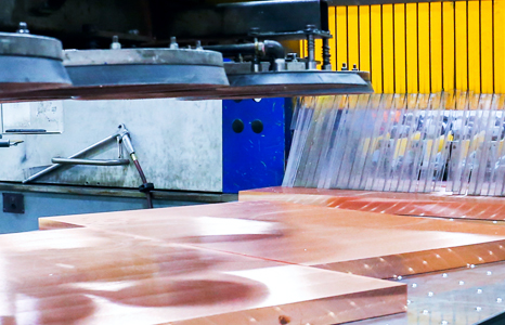 Copper plate being machined Copper plate being machined
