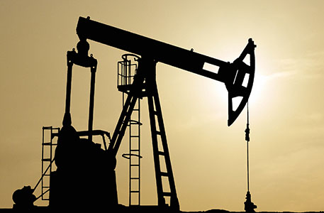 Silhouette of an oil pumpjack at sunset Silhouette of an oil pumpjack at sunset